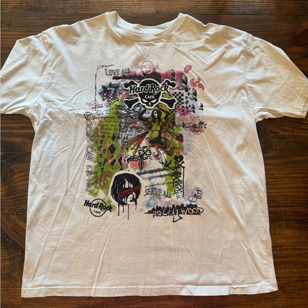 Vintage Hard Rock Cafe Hollywood light blue/gray Graphic Tee appears NWOT